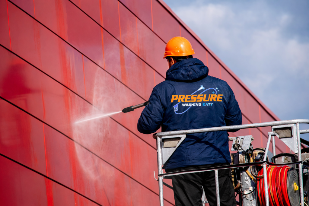 Pressure Washing Katy Working on a Tall Commercial property