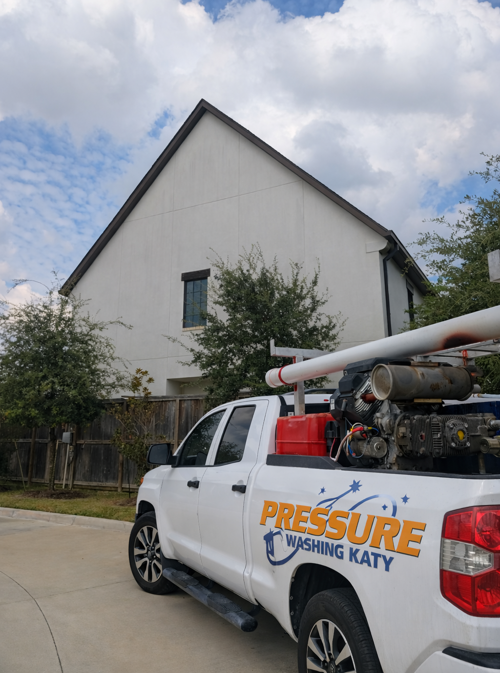 Pressure-Washing-Katy-Truck-infront-of-a-Power-Washed-House-In-Katy-TX